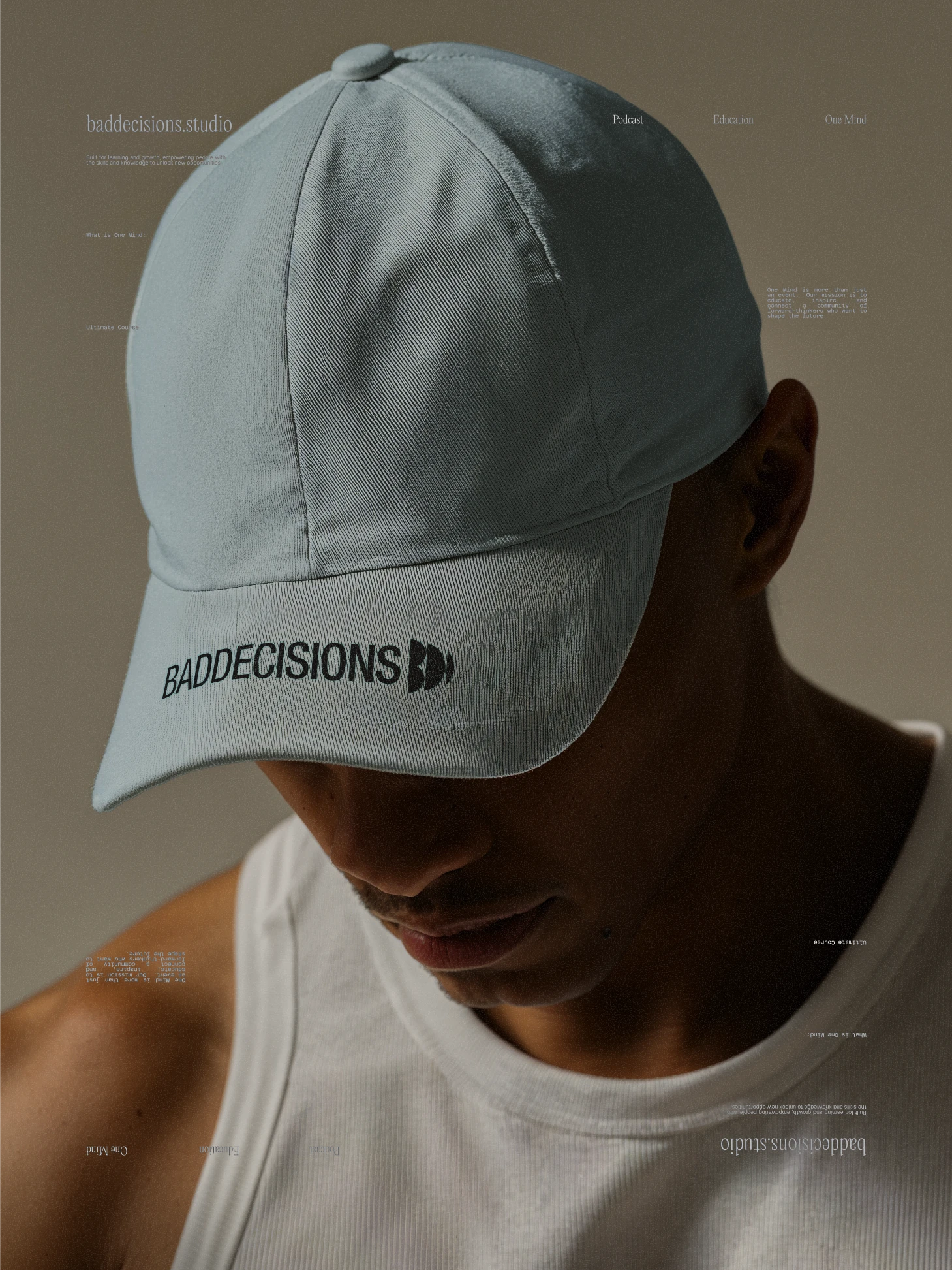 Man in a pale blue cap embroidered with the Bad Decisions wordmark and BD mark