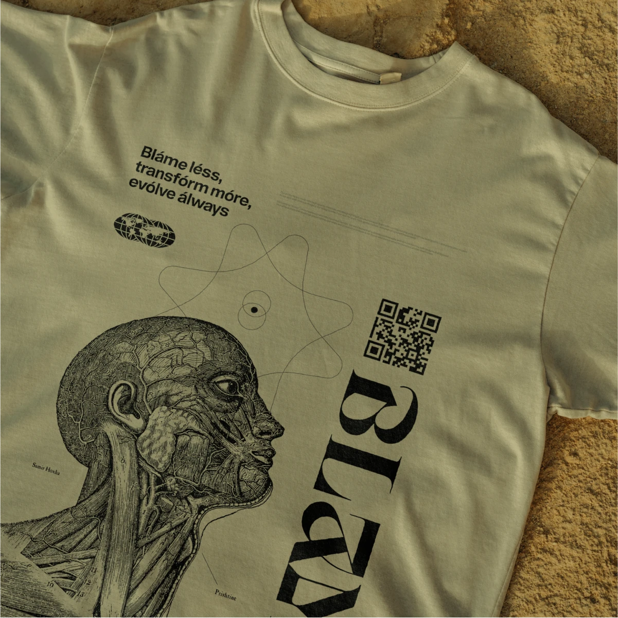 Cream Blame t-shirt printed with an engraved anatomical head, a QR code and the wordmark