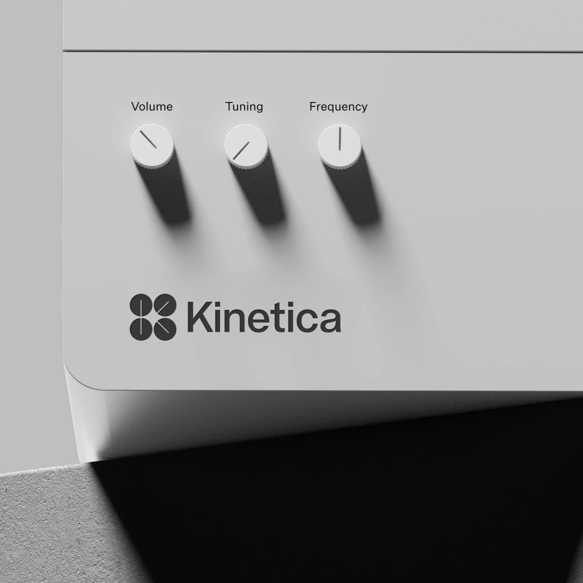 Silver Kinetica device with volume, tuning and frequency dials above the logo