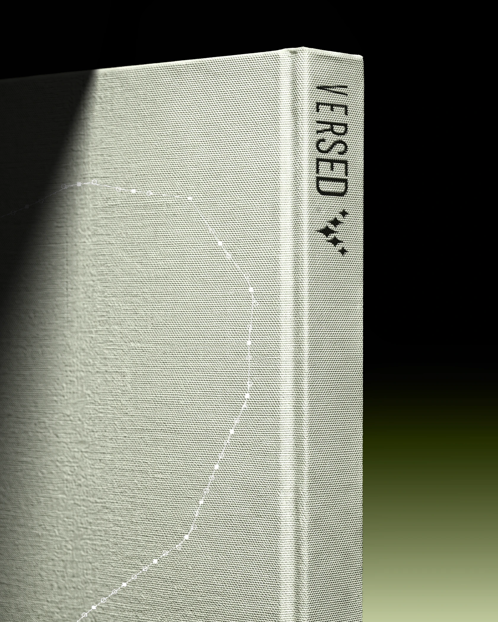 Versed journal standing in a beam of light, its linen spine with the wordmark and star mark